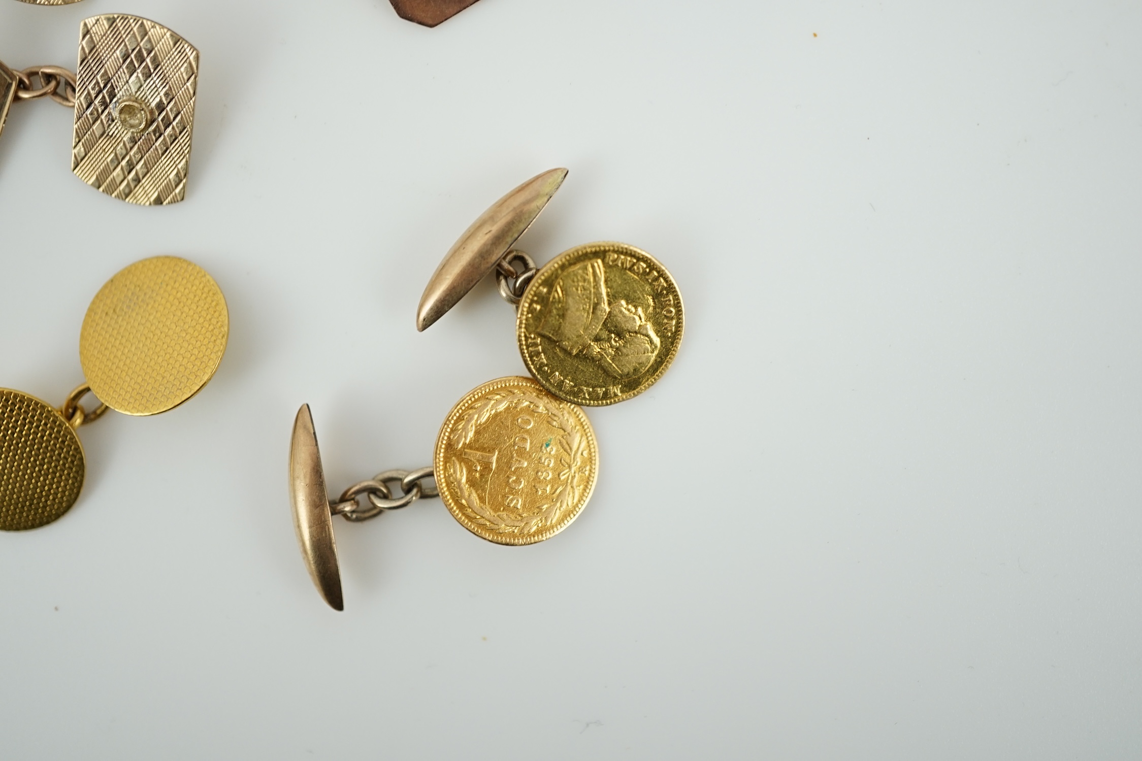 Two pairs of 9ct gold cufflinks and three single yellow metal cufflinks including coin set, gross weight 18.2 grams.